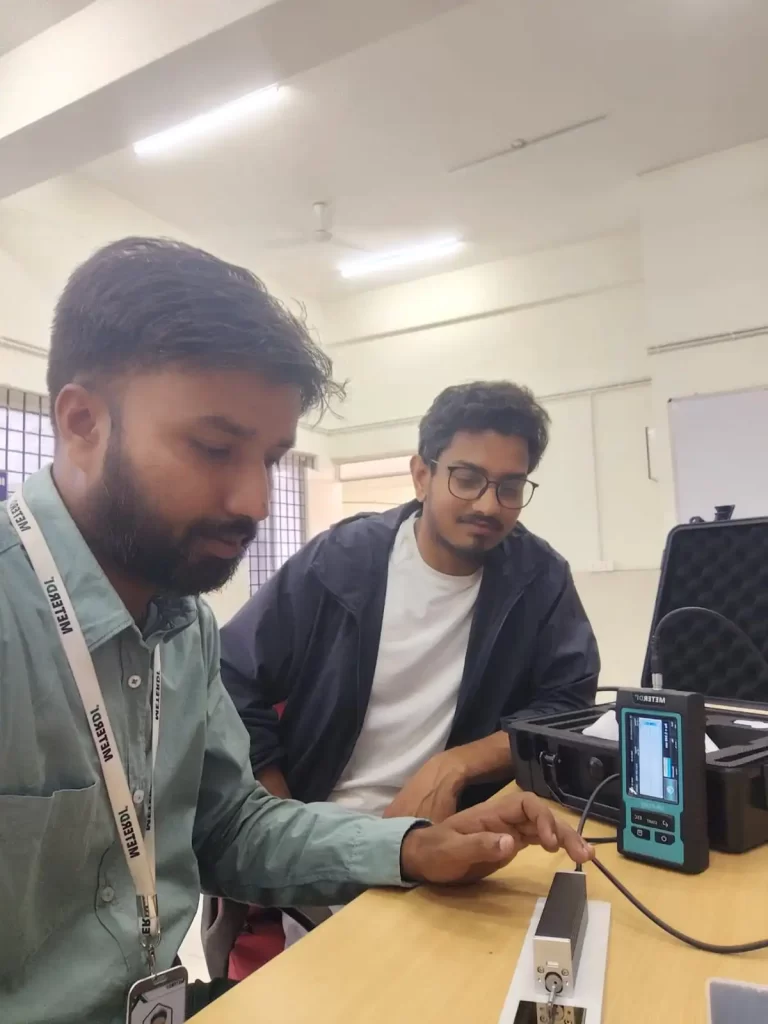 Technician testing metal part with METERDI Ra Tester
